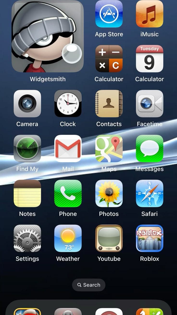 iOS Frutiger-era home screen with glossy skeuomorphic icons